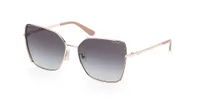 Guess GU00192 sunglasses in Shiny Pale Gold (32B) with smoke gradient lenses and nude temple tips, front three-quarter view