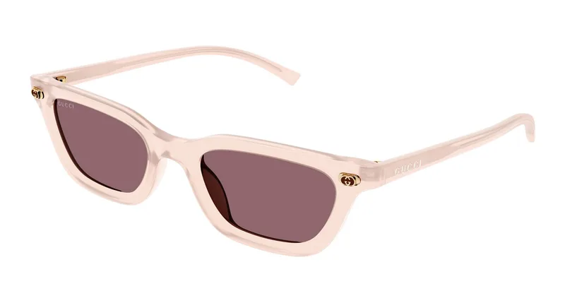 Gucci GG1944S cat-eye sunglasses in milky pink acetate with gold GG rivets and red-brown lenses (005), front three-quarter view