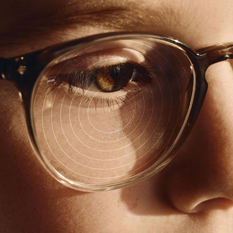 ZEISS FSV MyoCare Lenses, ZEISS close-up of a MyoCare lens showing the C.A.R.E. ring elements over the wearer's eye