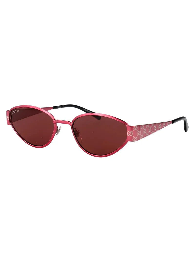 Gucci GG1853S 004 fuchsia metal oval sunglasses with red lenses and GG monogram temples, three-quarter view